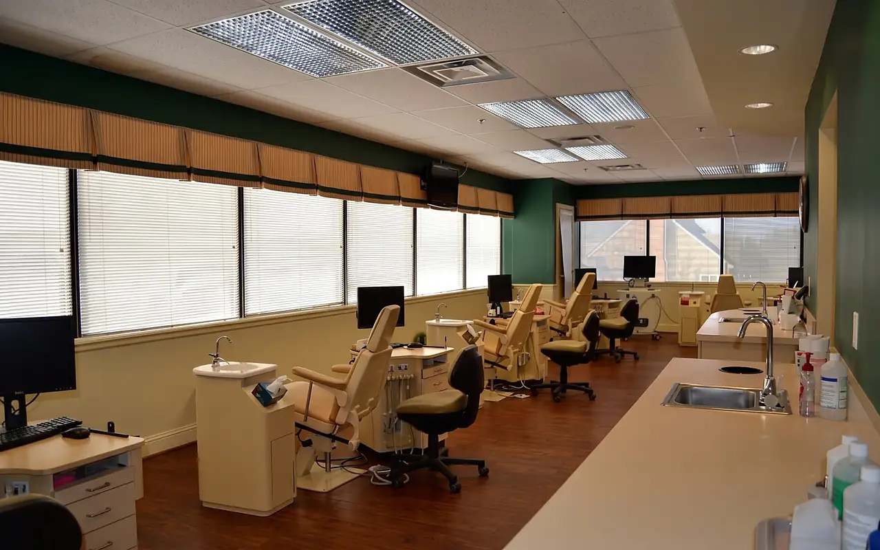 The open treatment bay at McInnes Palmer Orthodontics in Towson, with its row of orthodontic chairs under the windows.
